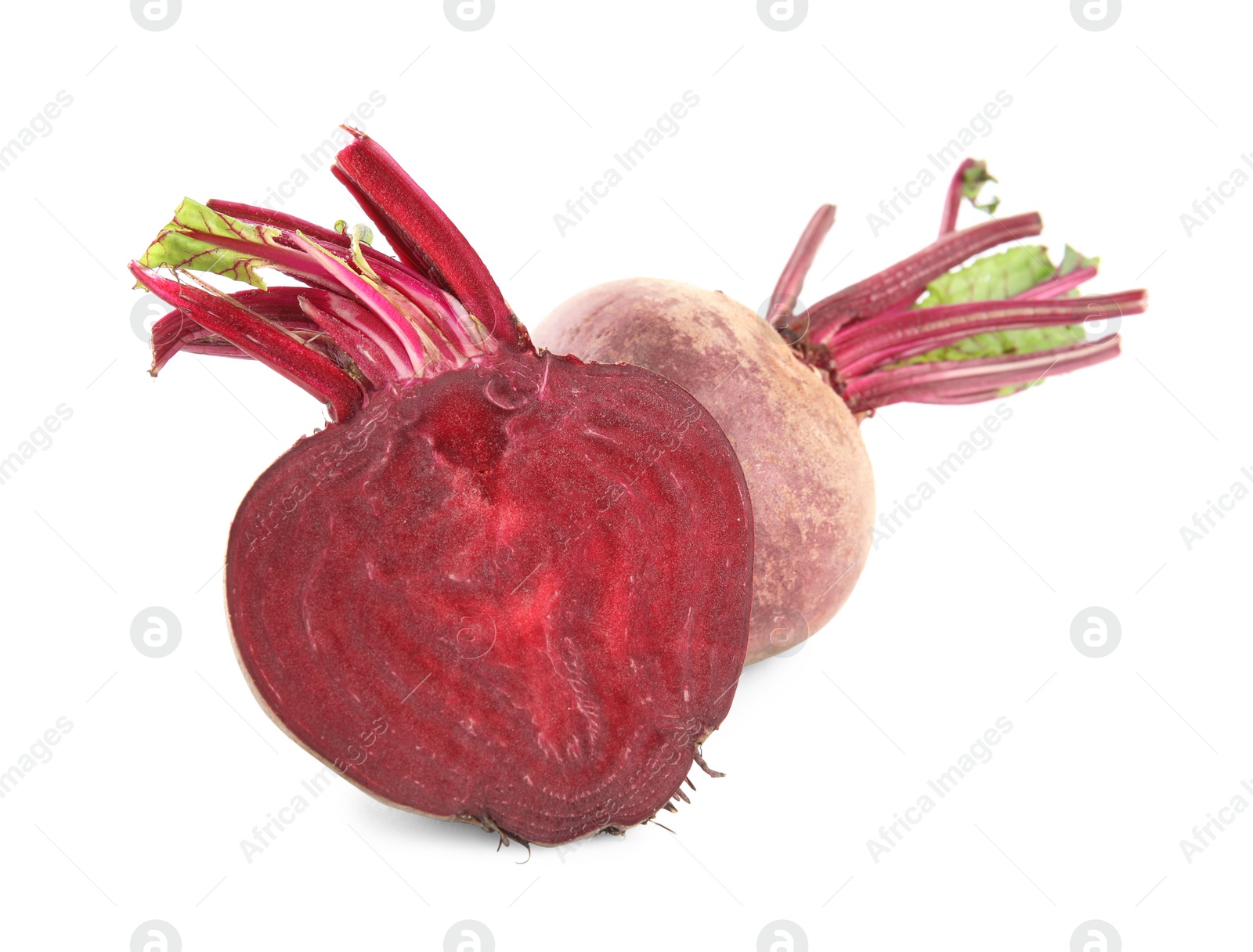 Photo of Whole and cut ripe beetroots on white background