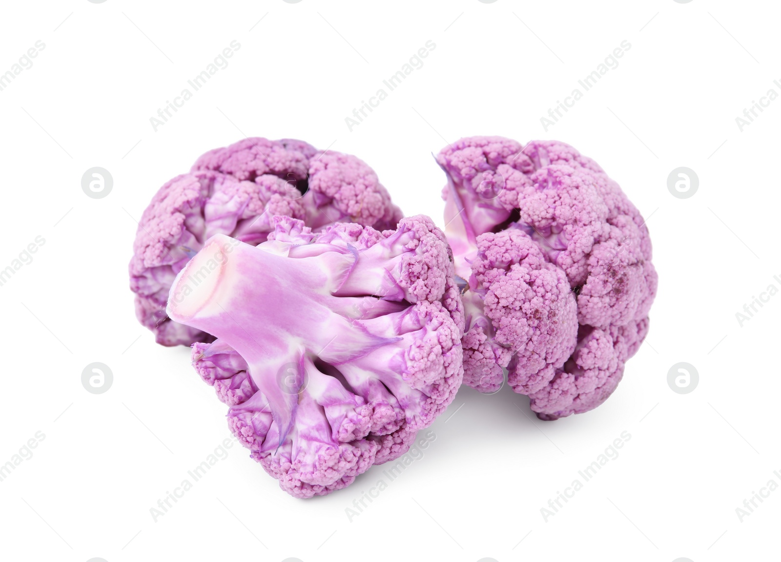 Photo of Cut purple cauliflowers on white background. Healthy food