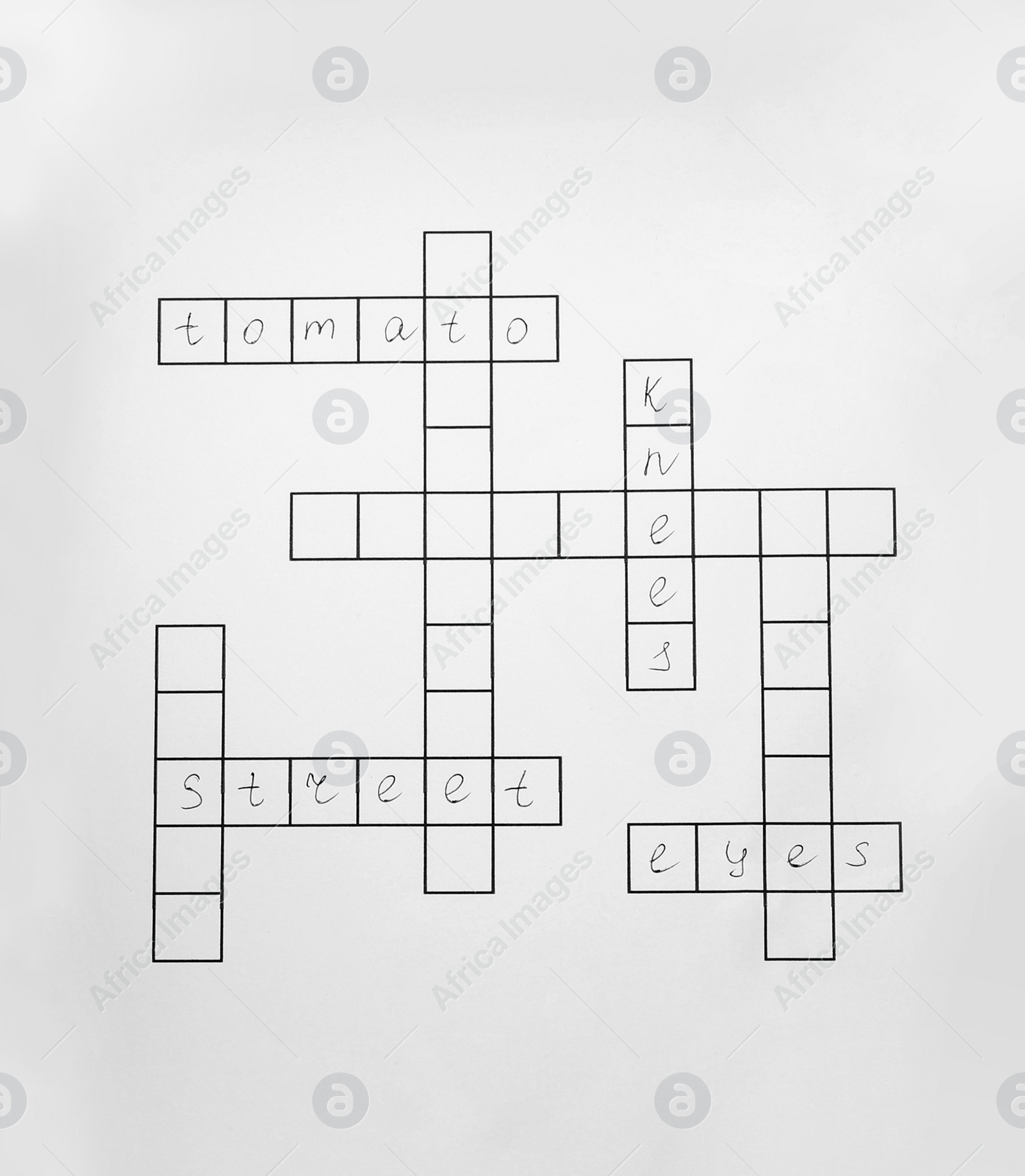 Photo of Blank crossword isolated on white, top view. Intellectual entertainment