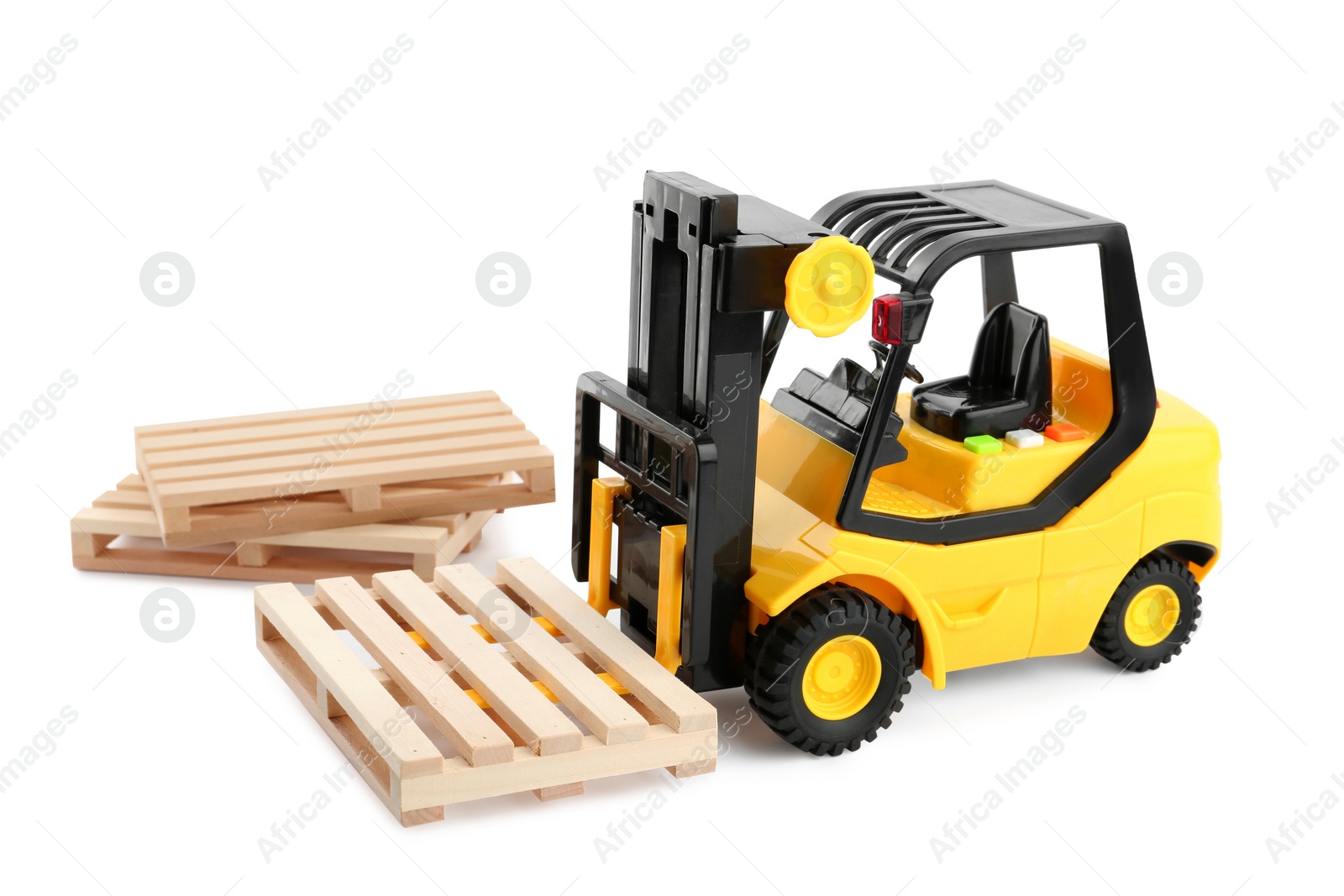 Photo of Toy forklift truck with wooden pallets on white background