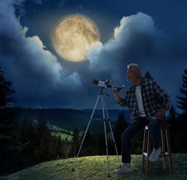 Image of Senior astronomer with telescope on hill at full moon night