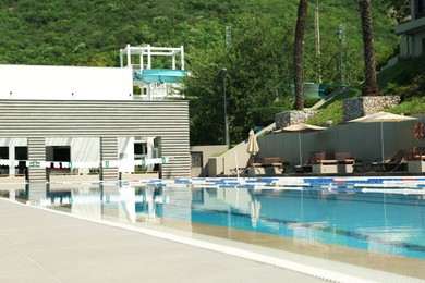 Photo of Outdoor swimming pool at luxury resort on sunny day