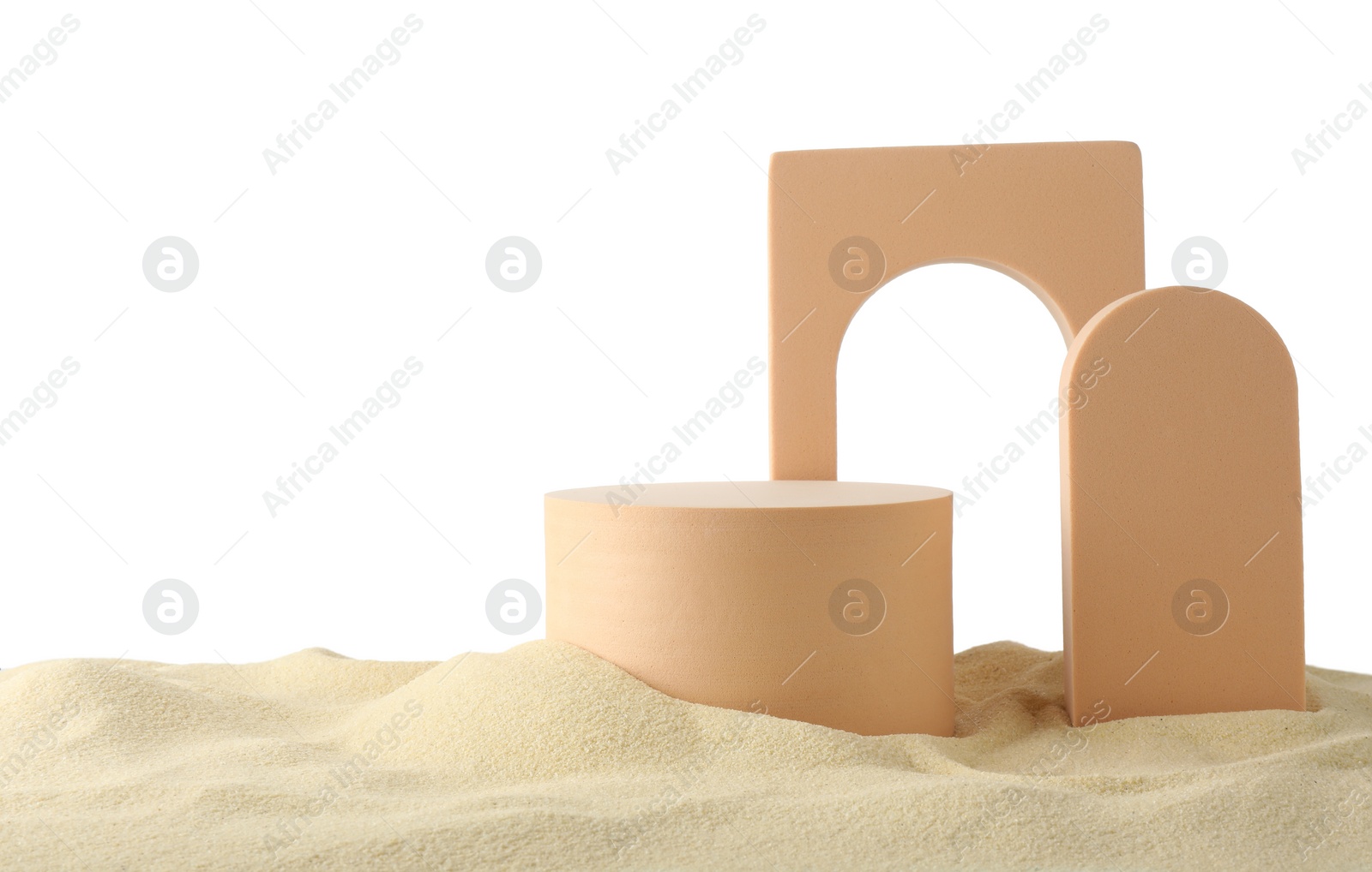 Photo of Presentation of product. Different podiums on sand against white background