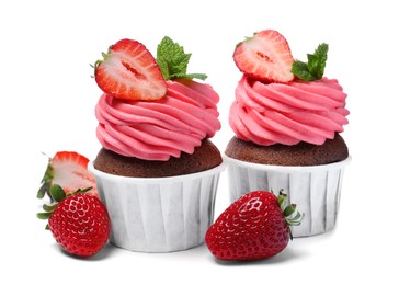 Photo of Sweet cupcakes with fresh strawberries on white background