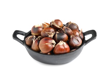 Photo of Delicious sweet roasted edible chestnuts in frying pan isolated on white