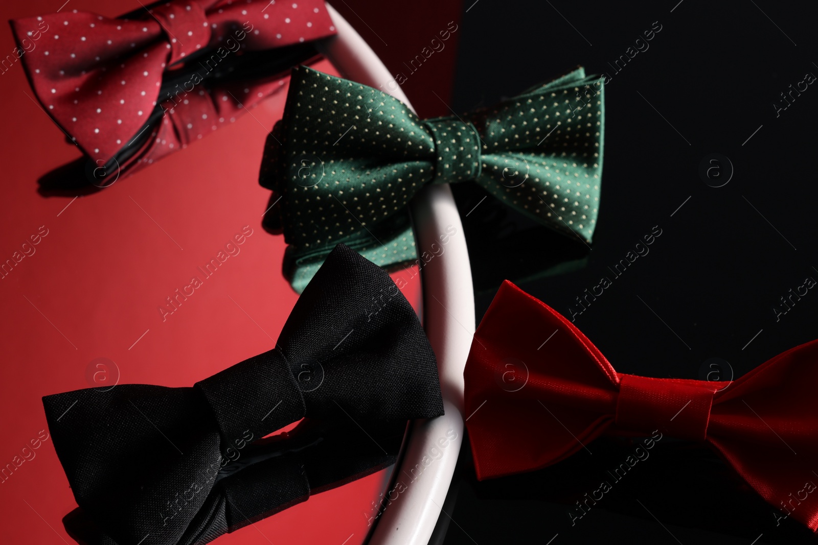 Photo of Different stylish bow ties on color background