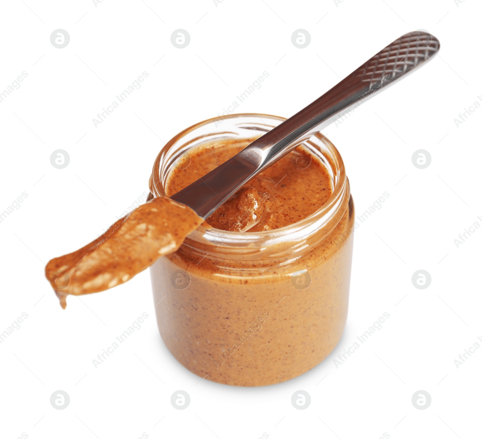 Photo of Tasty nut paste in jar and knife isolated on white