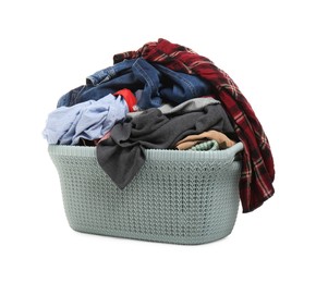 Photo of Plastic laundry basket full of clothes isolated on white