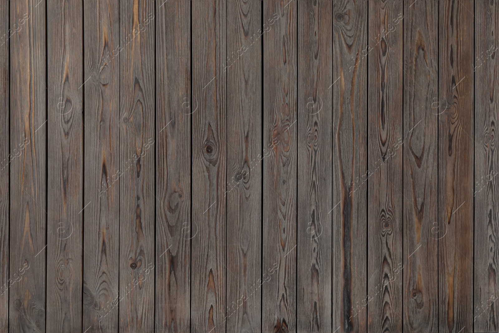 Photo of Texture of wooden board on black background, top view