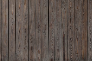 Photo of Texture of wooden board on black background, top view