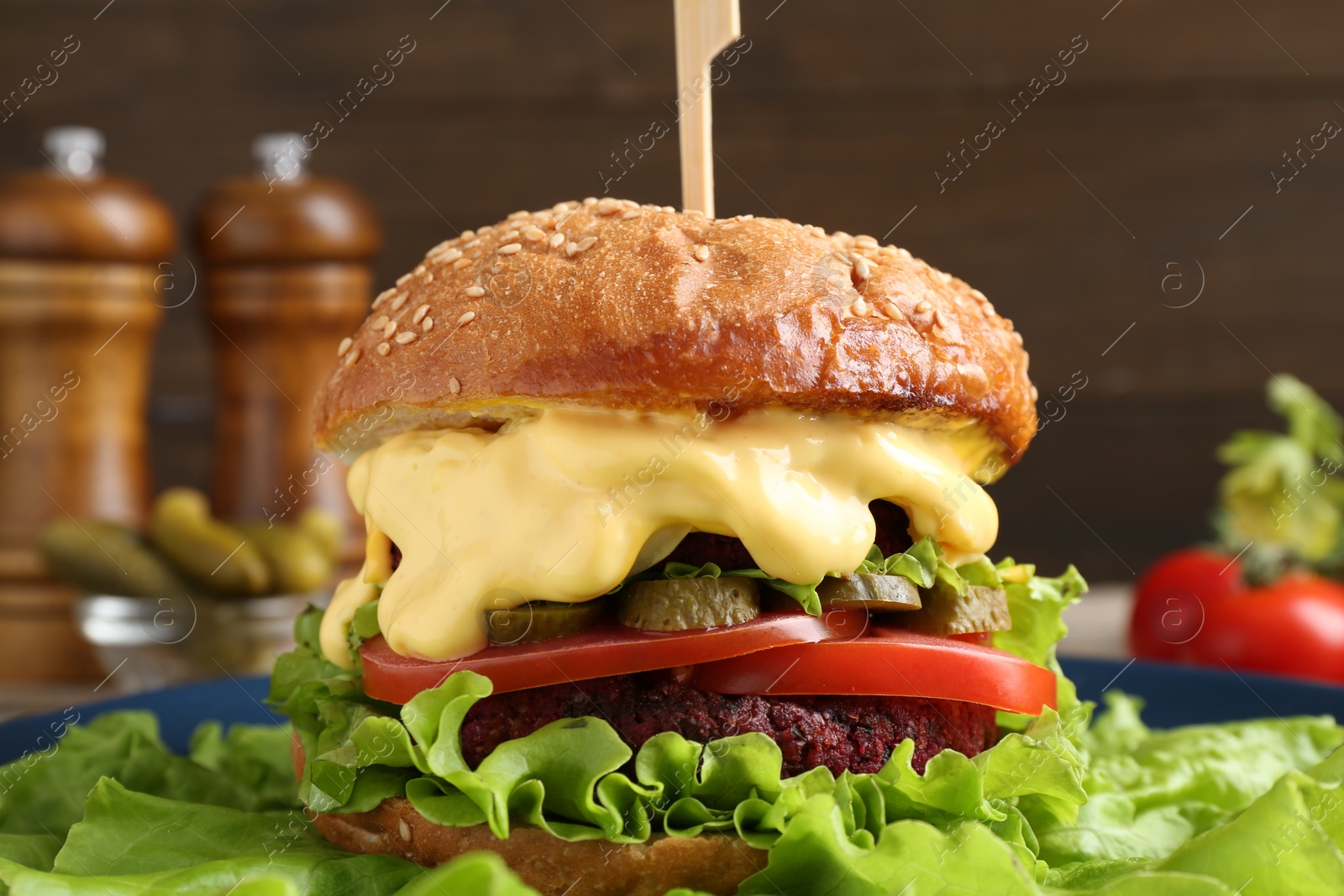 Photo of Delicious vegetarian burger on plate, closeup view