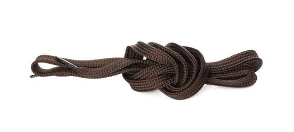 Photo of Dark brown shoe lace tied in knot isolated on white, top view