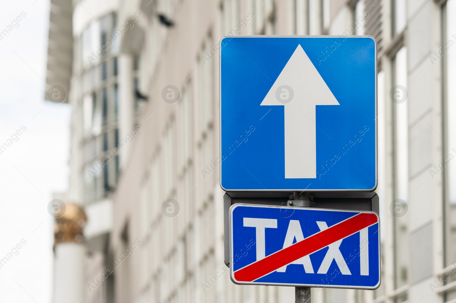 Photo of Traffic signs One Way Road and End Of Taxi Stand on city street, space for text