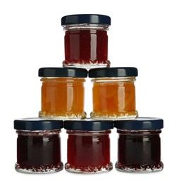 Jars with different jams on white background