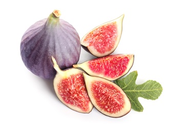 Whole and cut purple figs on white background