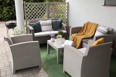 Beautiful terrace with comfortable furniture in yard