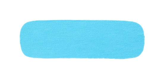 Light blue kinesio tape piece on white background, top view