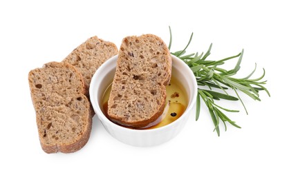 Photo of Bowl of organic balsamic vinegar with oil served with spices and bread slices isolated on white