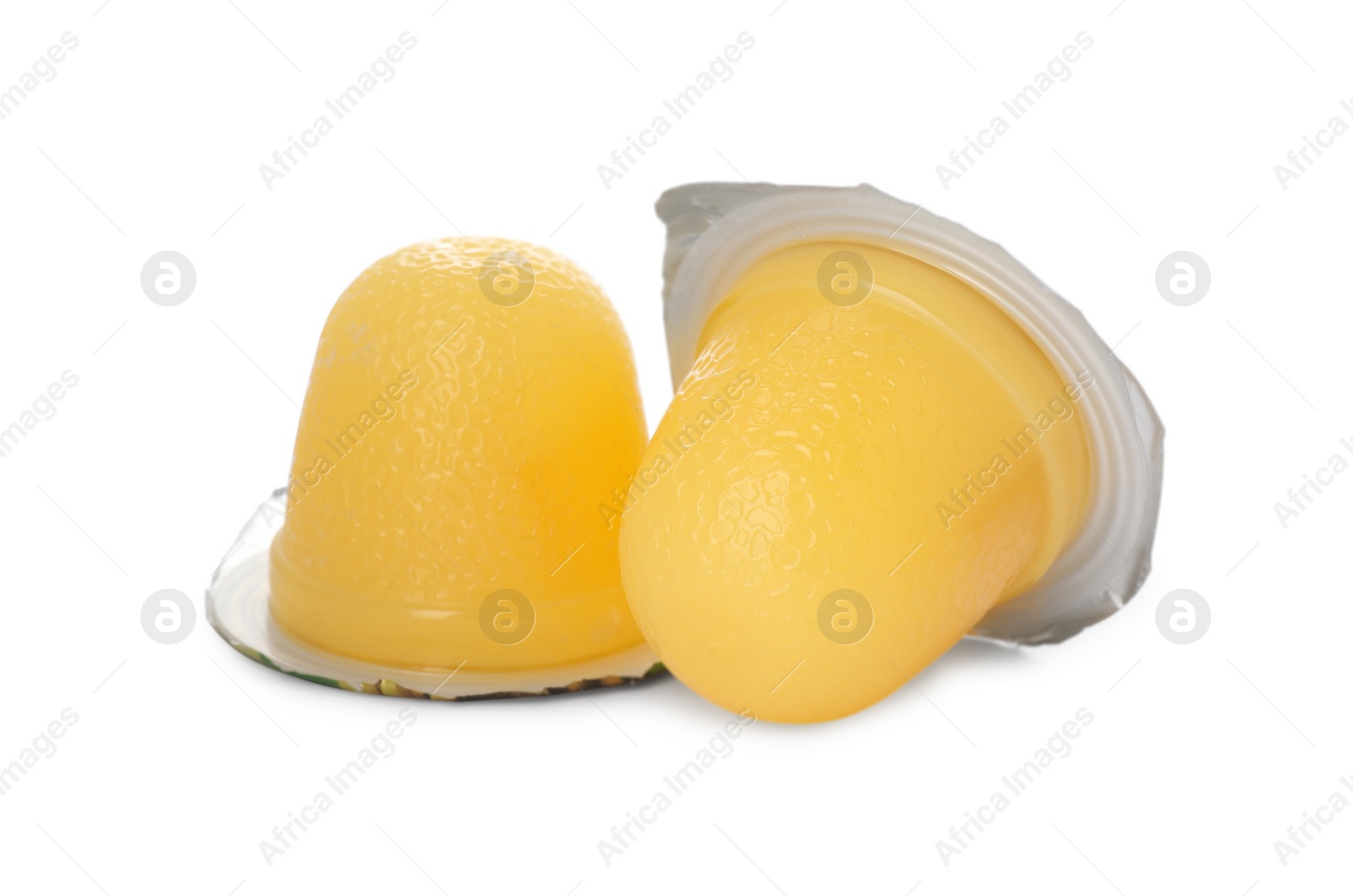 Photo of Delicious yellow jelly cups on white background