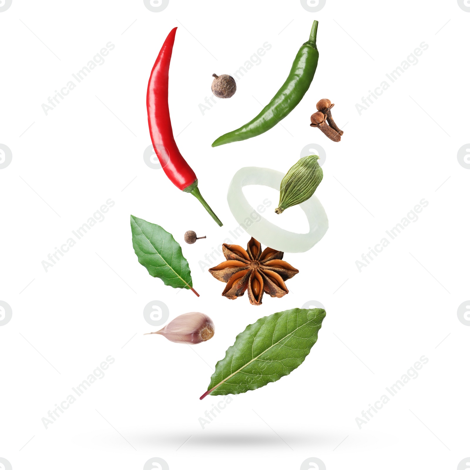 Image of Different aromatic spices falling on white background