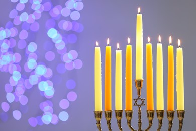 Photo of Hanukkah celebration. Menorah with burning candles on grey background with blurred lights, space for text