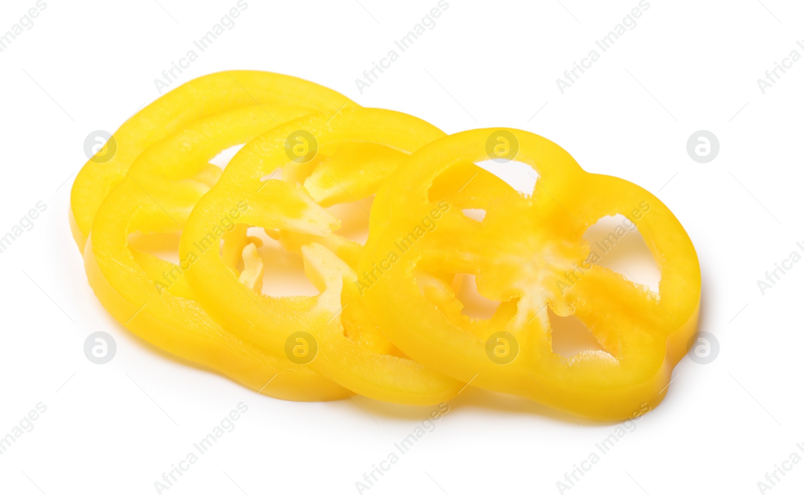 Photo of Slices of yellow bell pepper on white background