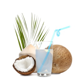 Photo of Glass of coconut milk and nuts on white background