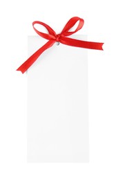 Photo of Blank gift tag with red satin ribbon on white background, top view. Space for design