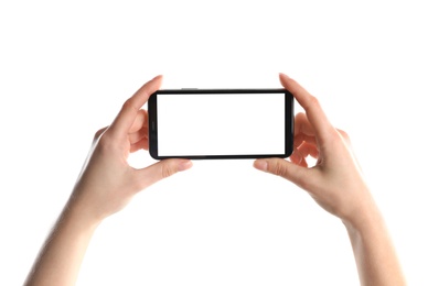 Photo of Woman holding smartphone with blank screen on white background, closeup of hands. Space for text