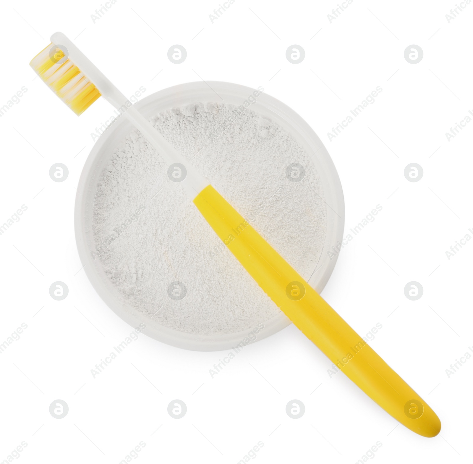 Photo of Bowl of tooth powder and brush on white background, top view