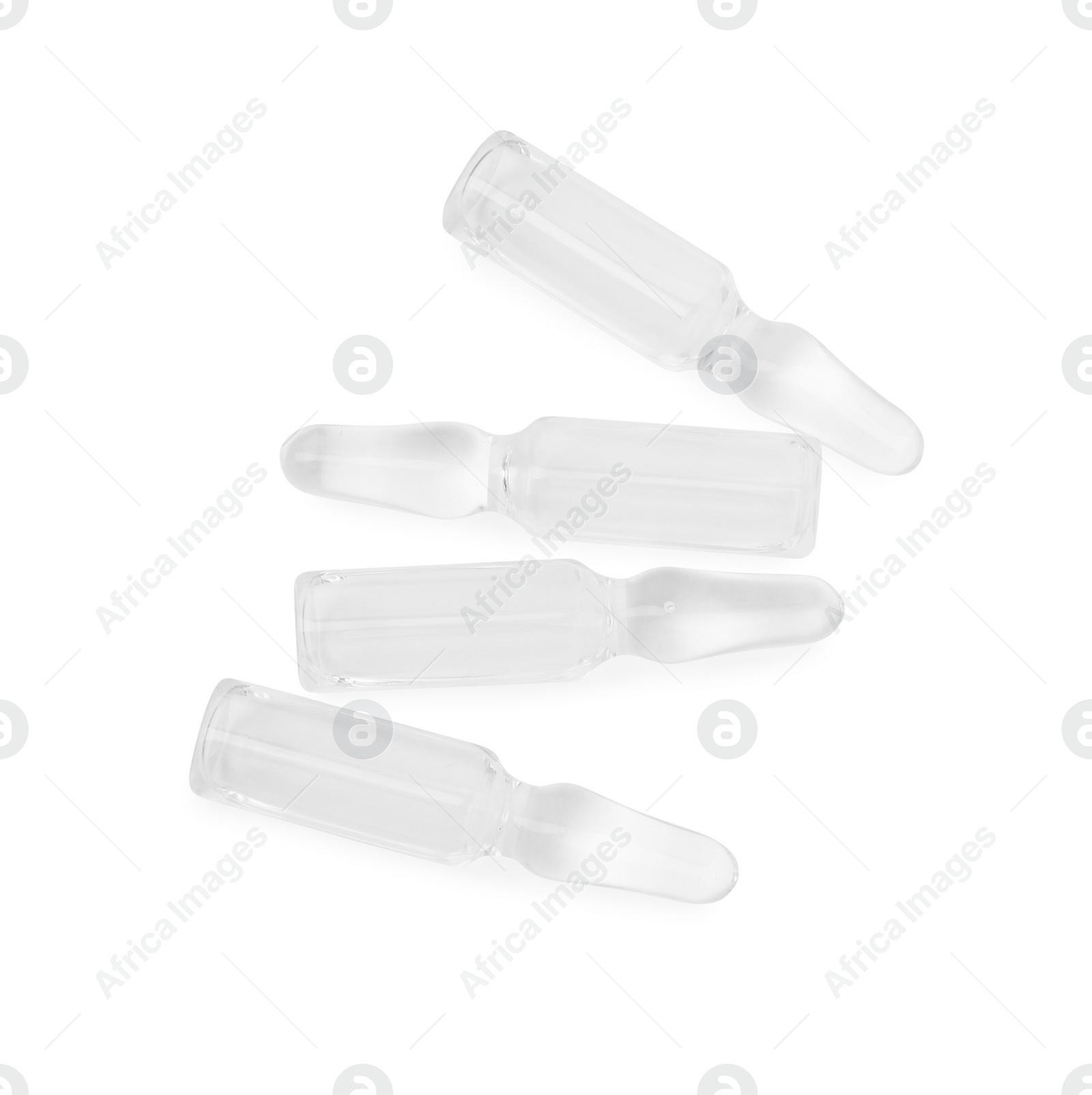 Photo of Glass ampoules with liquid isolated on white, top view