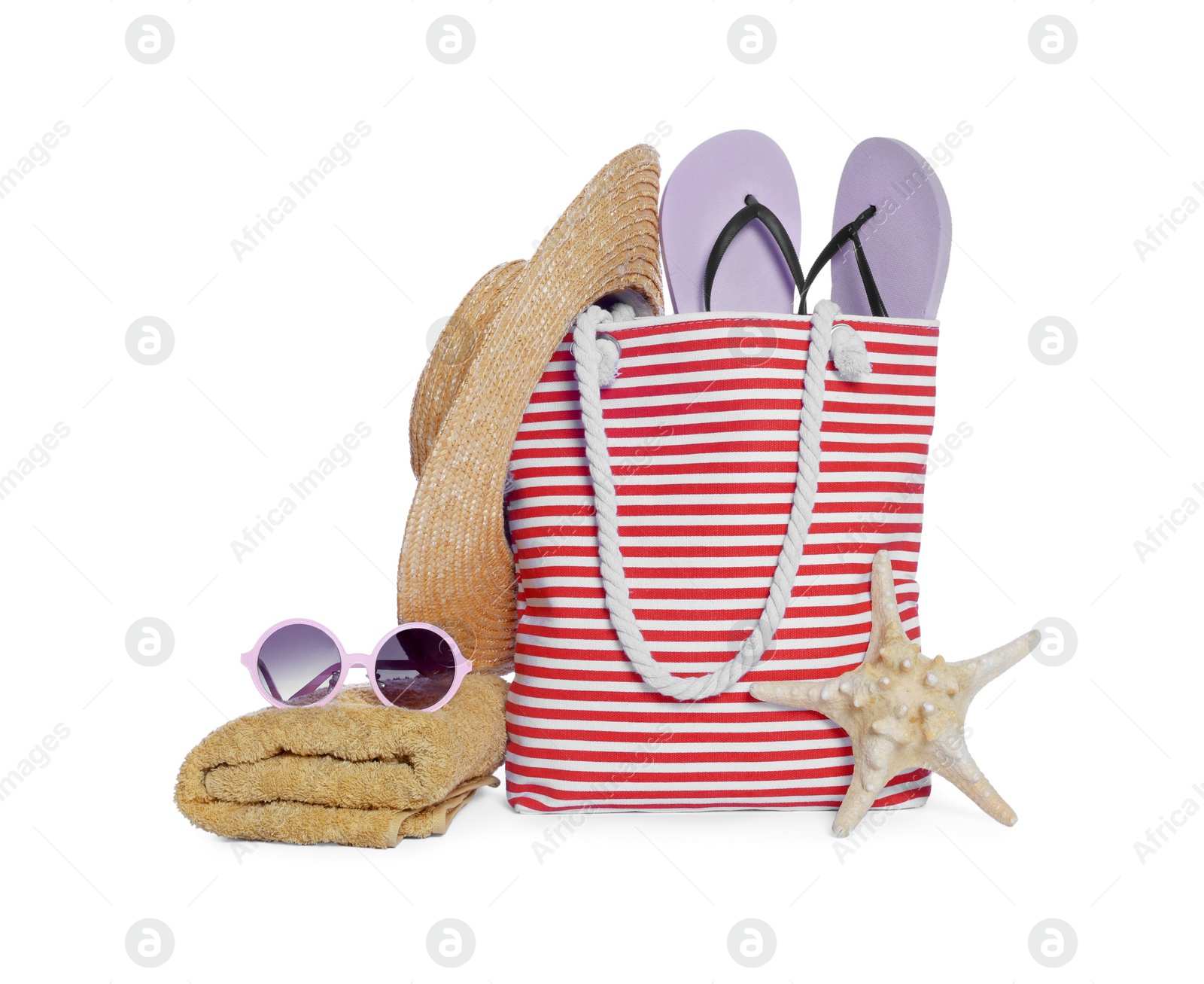 Photo of Stylish bag, starfish and other beach accessories isolated on white