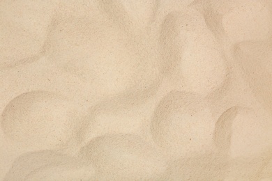 Photo of Dry beach sand as background, top view