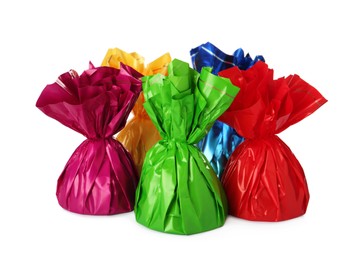 Photo of Delicious candies in colorful wrappers on white background