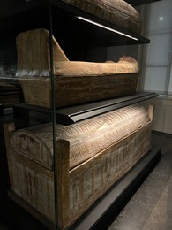 LEIDEN, NETHERLANDS - AUGUST 07, 2022: Display with Ancient Egyptian sarcophagi in National Museum of Antiquities (Rijksmuseum van Oudheden)