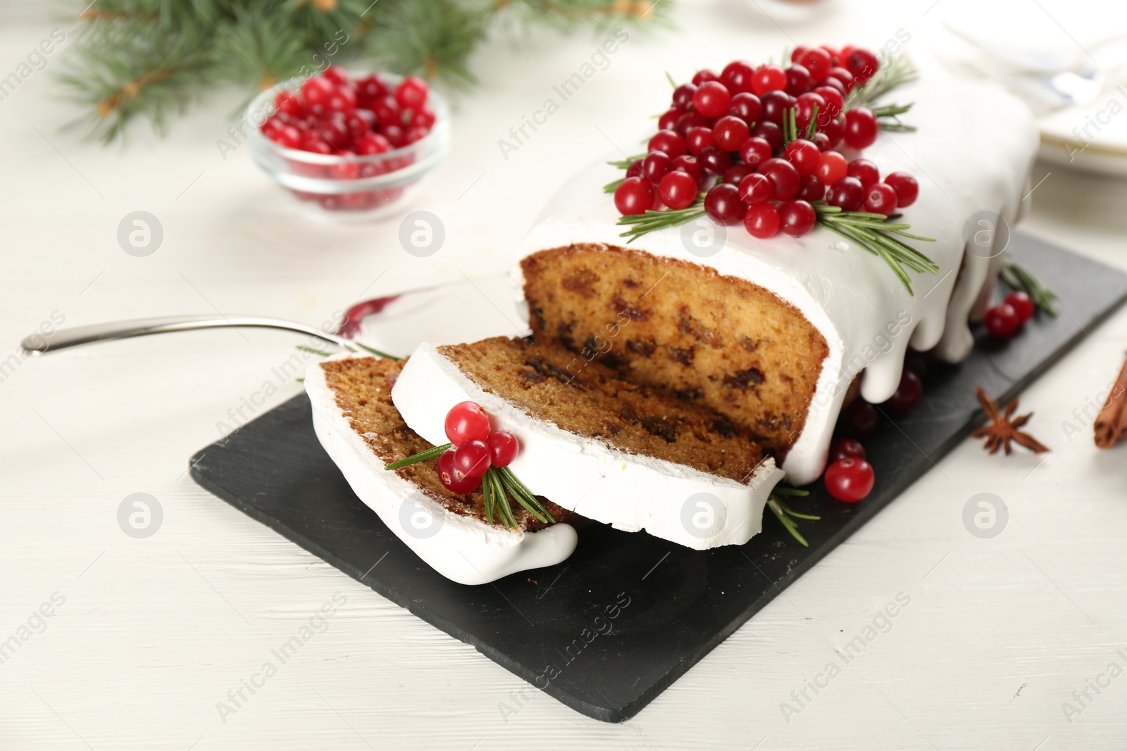 Photo of Traditional Christmas cake on white wooden table. Classic recipe
