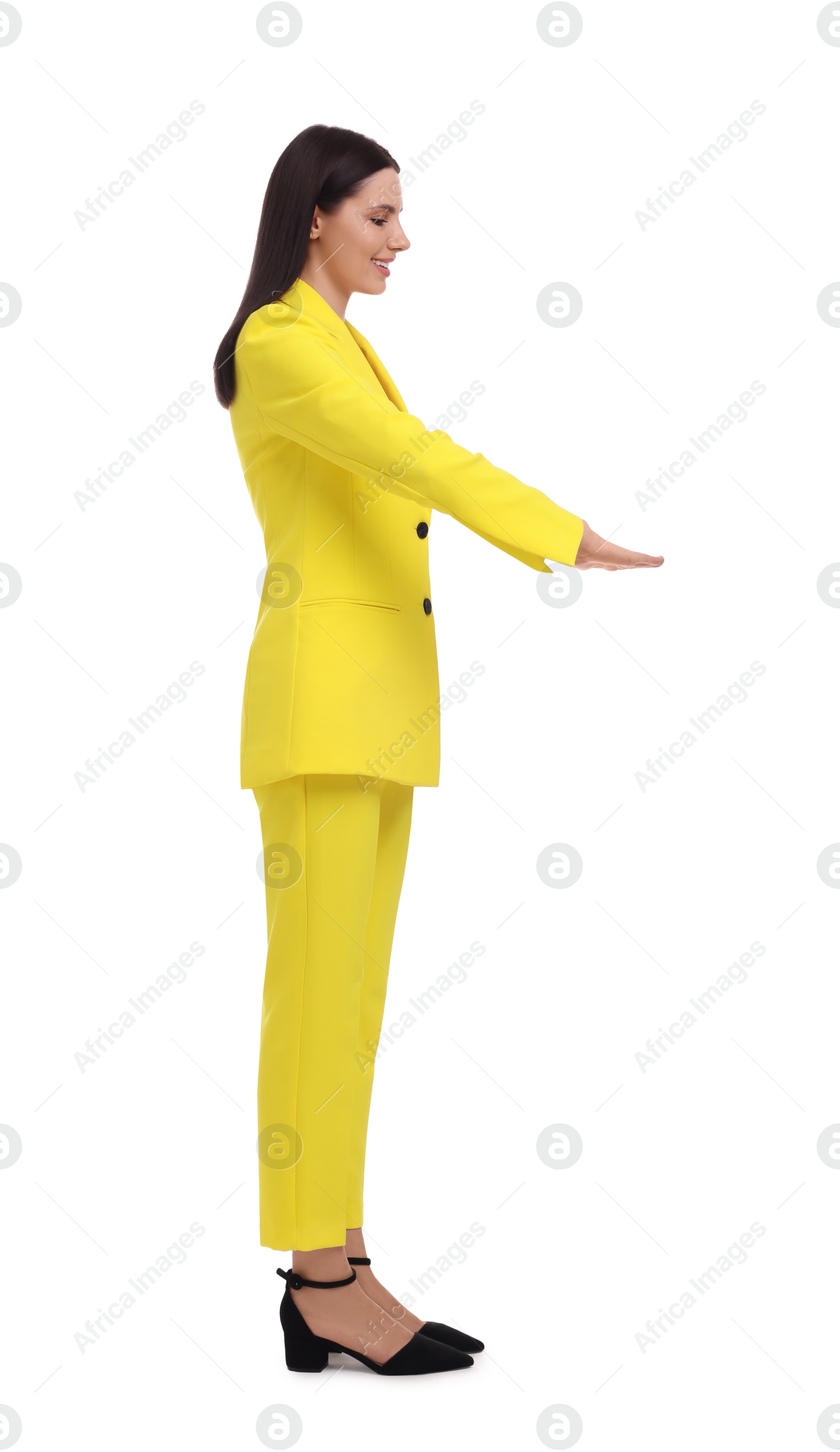 Photo of Beautiful businesswoman in yellow suit on white background