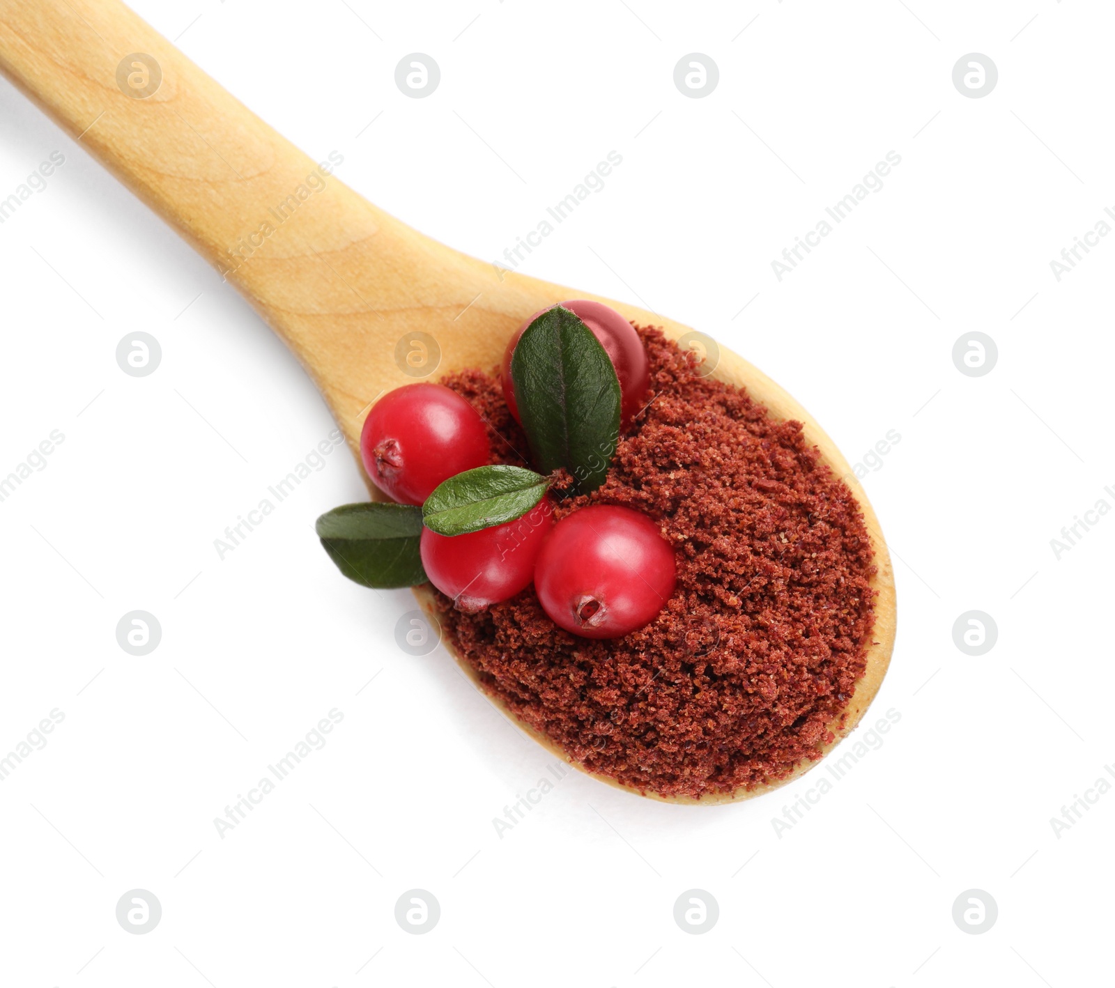 Photo of Wooden spoon with dried cranberry powder, fresh berries and green leaves isolated on white, top view