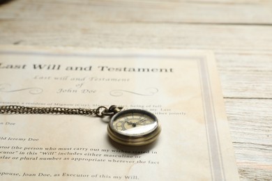 Photo of Last Will and Testament with pocket watch on white wooden table, closeup. Space for text