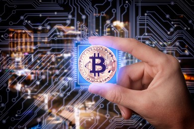 Image of Man holding bitcoin against digital scheme and cityscape, closeup