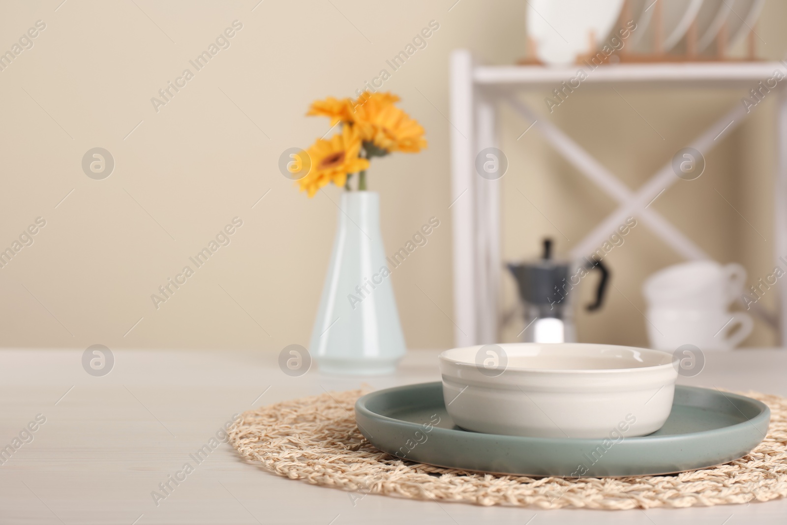 Photo of Clean plate and bowl on wooden table indoors, space for text