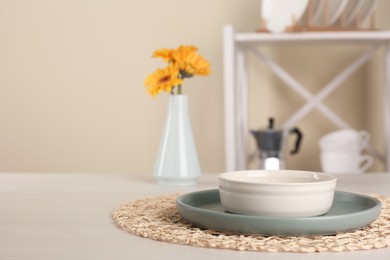Clean plate and bowl on wooden table indoors, space for text