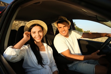 Photo of Happy couple in car on road trip