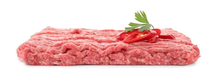 Raw ground meat, chili pepper and parsley isolated on white