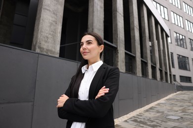 Photo of Portrait of beautiful woman outdoors. Lawyer, businesswoman, accountant or manager