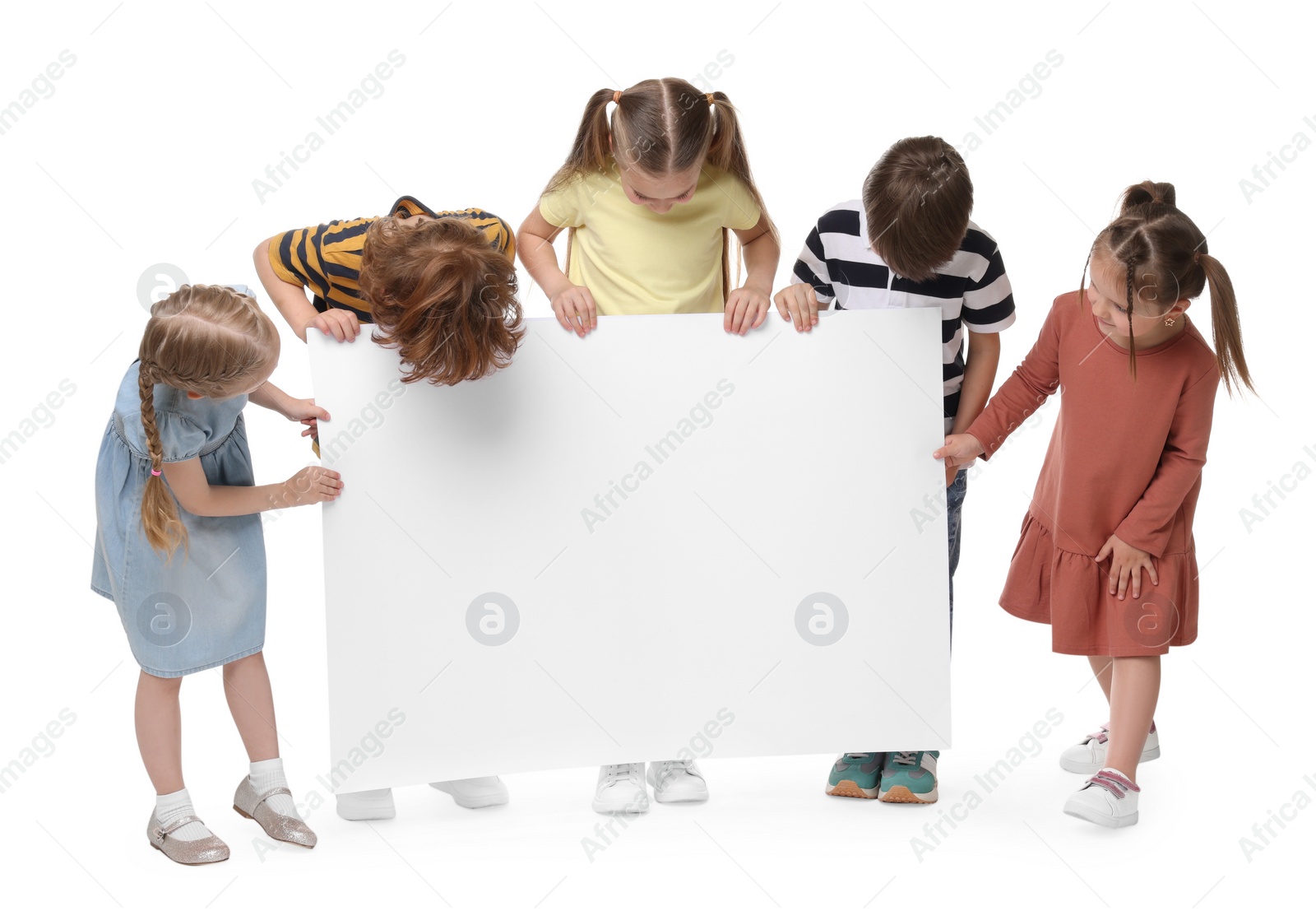 Photo of Group of children with blank poster on white background. Mockup for design