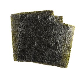 Dry nori sheets on white background, top view