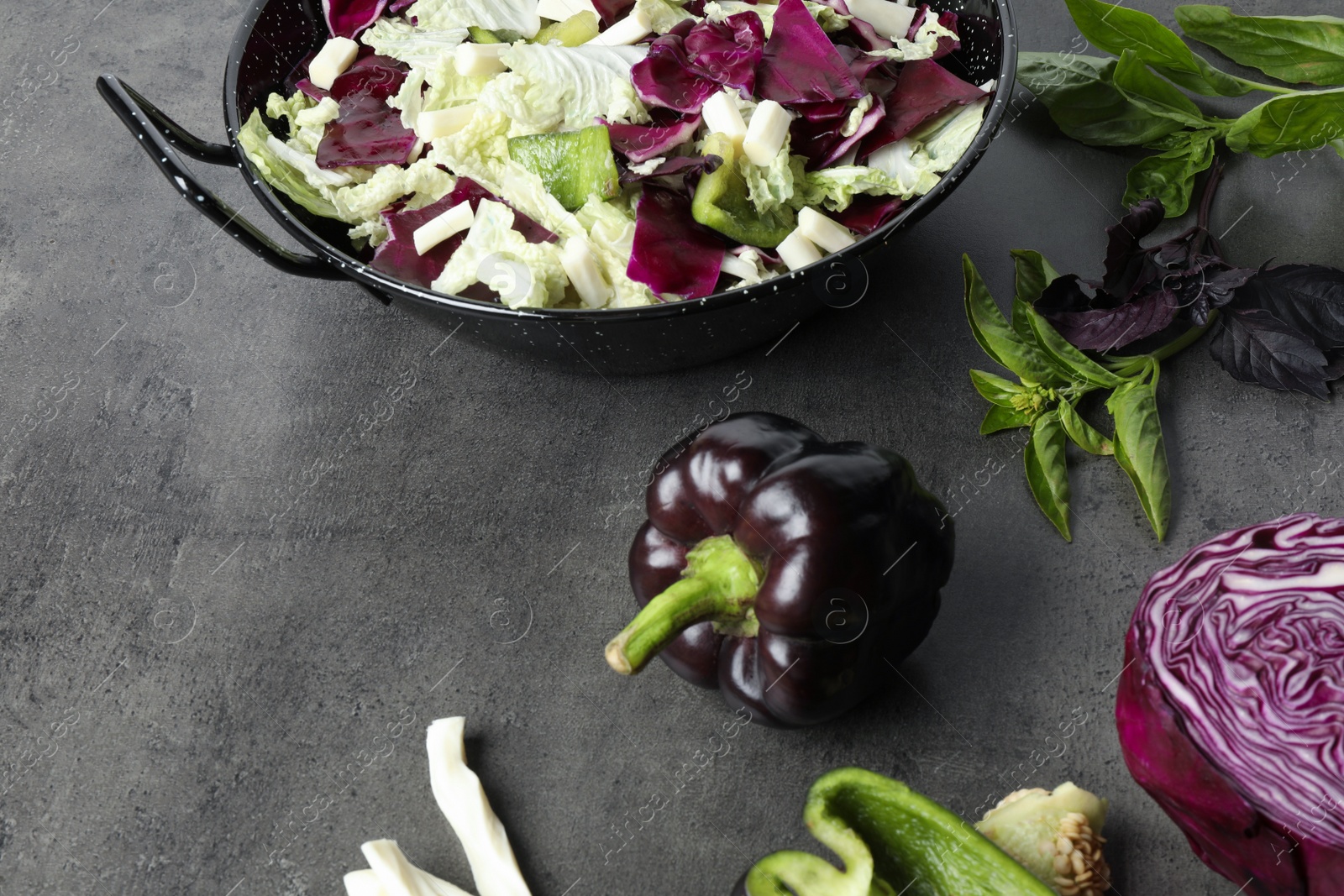 Photo of Delicious salad with Chinese cabbage, bell pepper and suluguni cheese on grey table