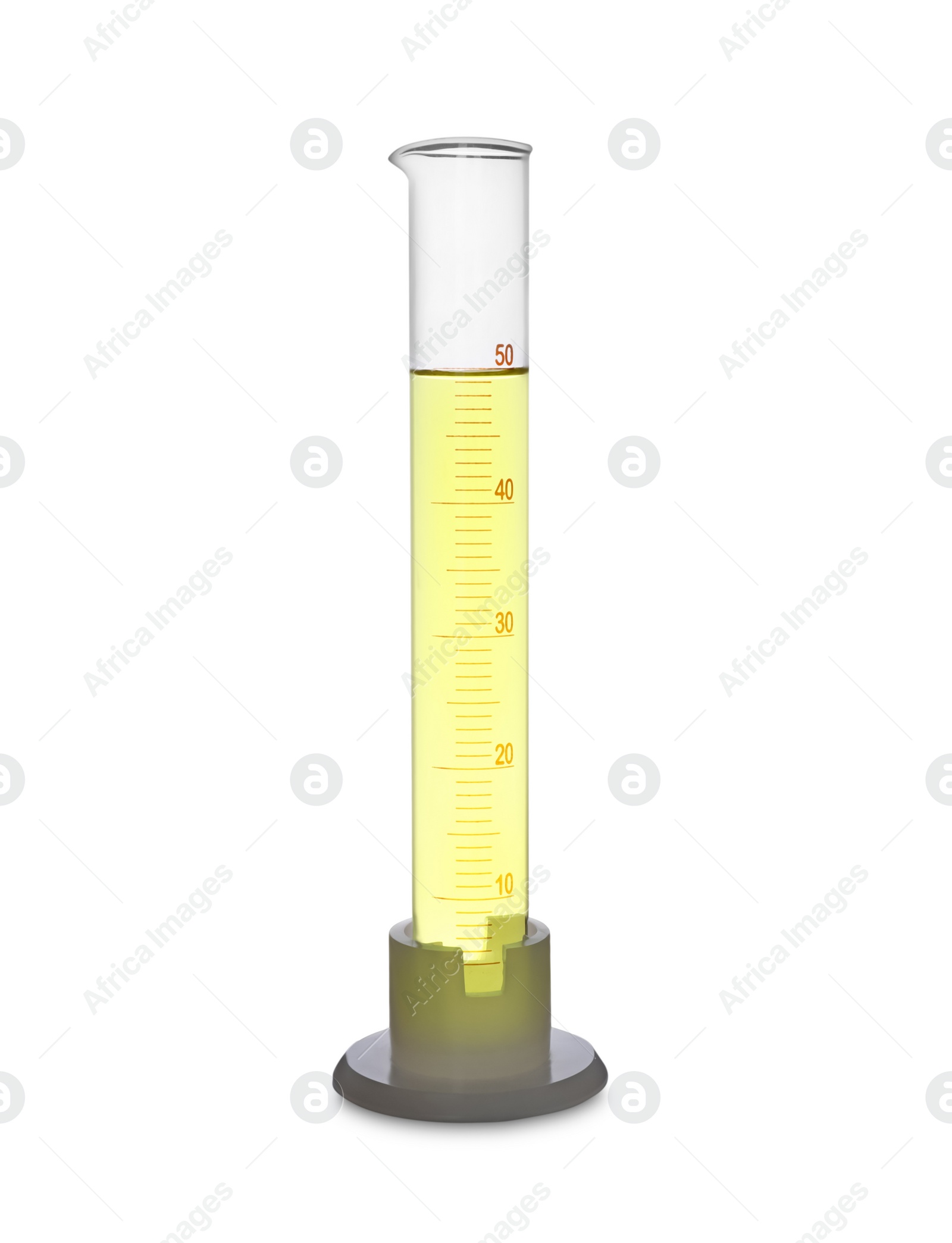 Photo of Graduated cylinder with yellow liquid isolated on white