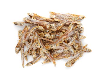 Photo of Delicious dried salted anchovies on white background, top view